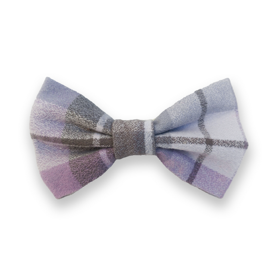 A purple flannel flannel snap on bow tie for easy-on wear. Handmade in the USA with 100% cotton soft and thick flannel fabric.  Bow ties fit up to 1" collars with gold metal snaps. Snaps secure tightly for a snug fit - no bow tie droops with these! Reference sizing for bow tie sizes.